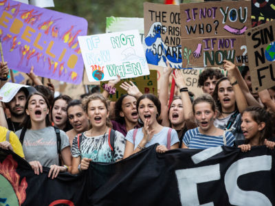 Demonstrators hold banners at a protest in support of the global climate strike on September 27, 2019, in Barcelona, Spain.