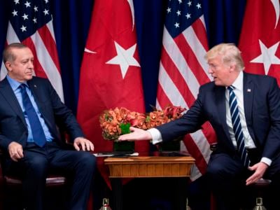Donald Trump extends a hand to shake Recep Tayyip Erdogan's hand