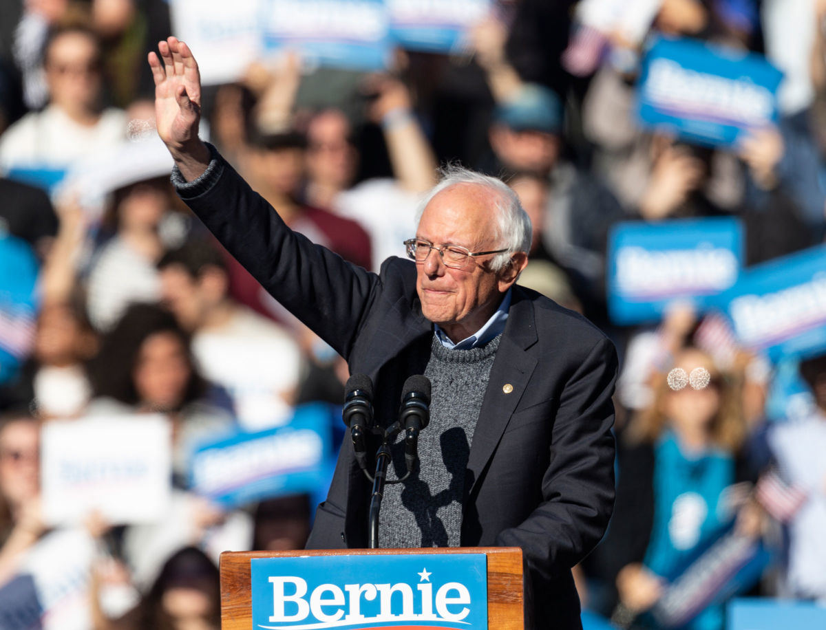 Bernie Sanders waves at the crowd gathered for his campaign rally