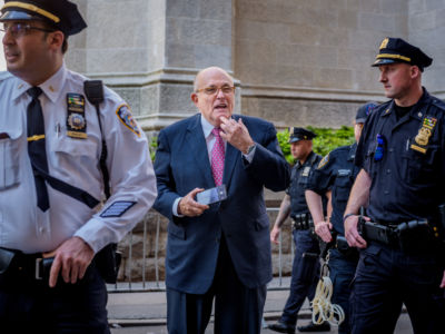 Donald Trump's lawyer Rudy Giuliani reacting to a crowd booing him in New York City, May 23, 2018.