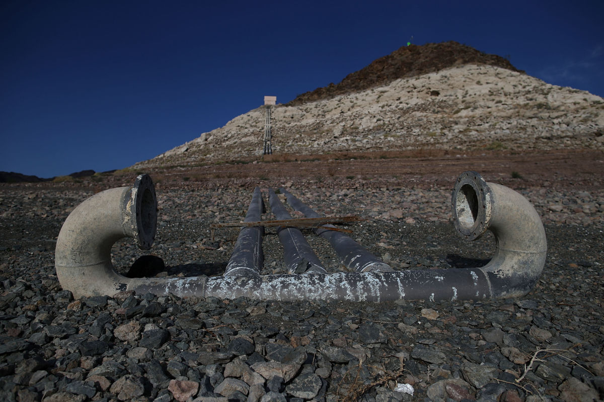 Pipes for a water intake pump sit on dry land in front of Pyramid Island near Boulder Beach on May 13, 2015, in Lake Mead National Recreation Area, Nevada.