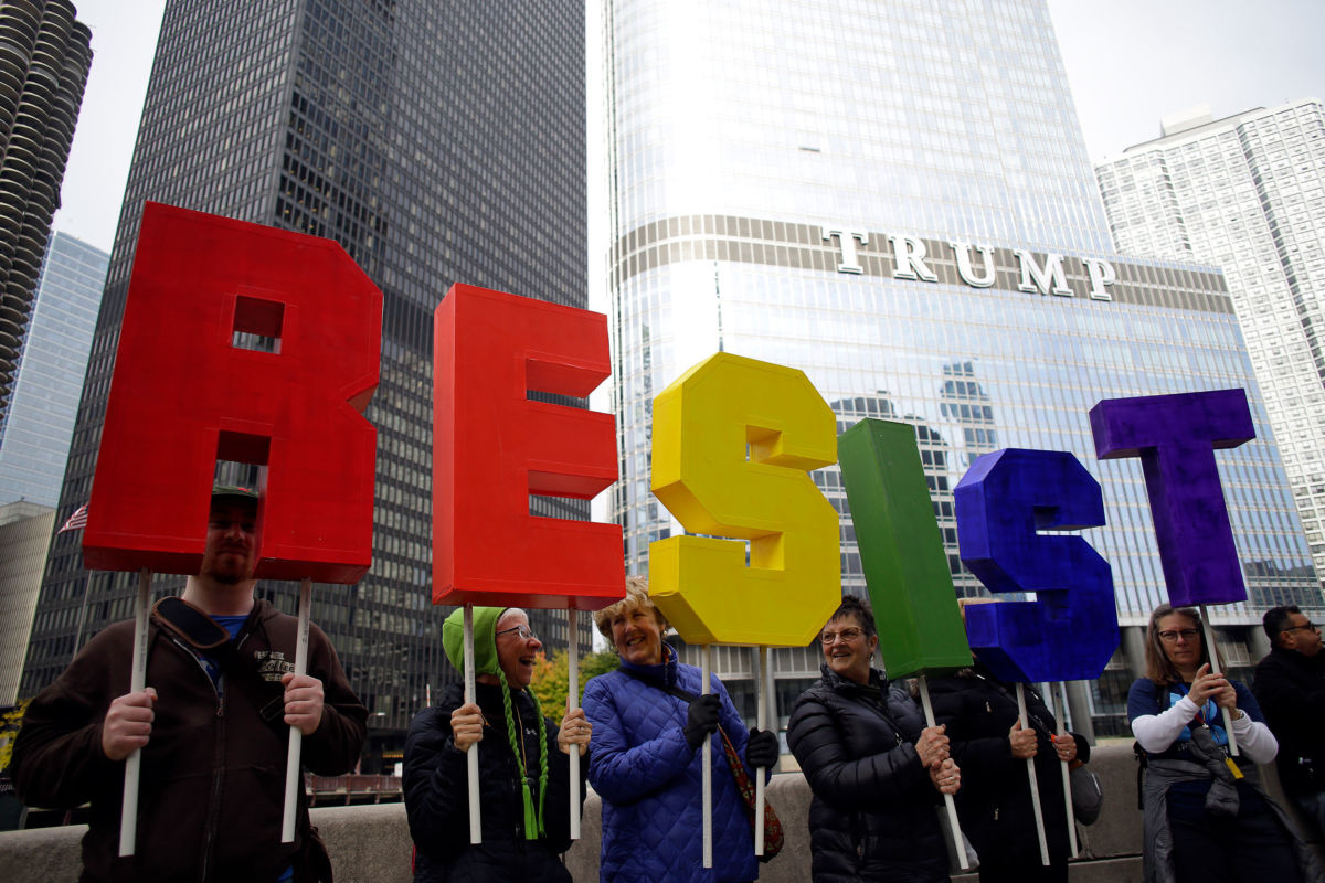 Demonstrators protest President Donald Trump's visit to Chicago outside Trump International Hotel & Tower on October 28, 2019, in Chicago, Illinois.