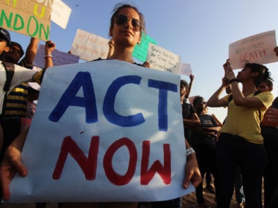 Students and people hold placards as they participate in a rally against climate change in Mumbai, India, on May 24, 2019.
