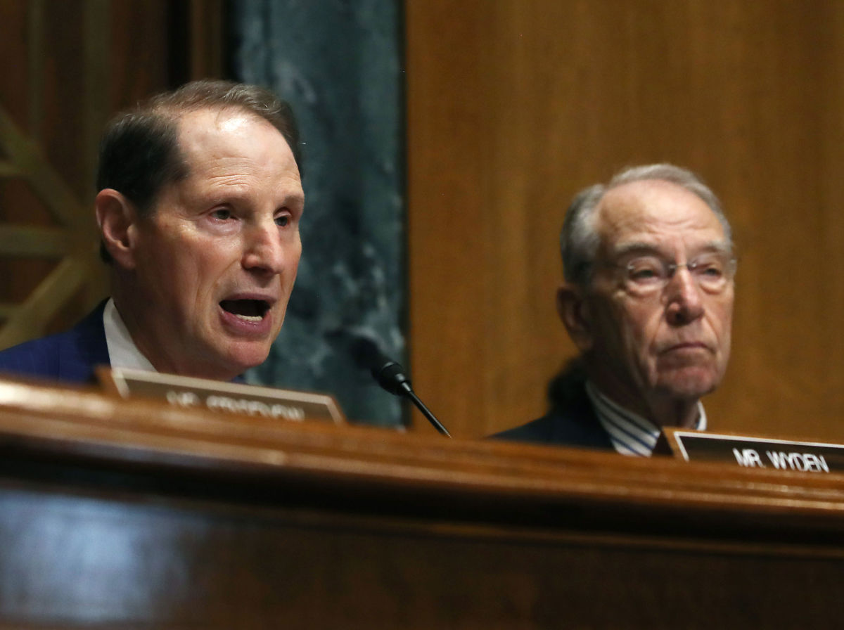Sen. Ron Wyden, left, speaks while Chairman Chuck Grassley listens, during a Senate Finance Committee hearing on June 18, 2019, in Washington, D.C.
