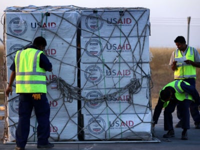 Airport personnel check humanitarian aid supplies from USAID in Arbil, the capital of the autonomous Kurdish region of northern Iraq, on September 2, 2014.
