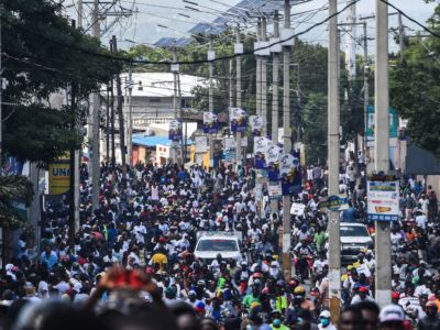 Protesters march on the street to demand the resignation of the Haitian president in Port-au-Prince, Haiti on October 13, 2019.