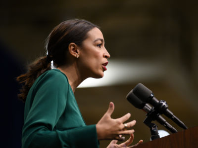 U.S. Rep. Alexandria Ocasio-Cortez (D-NY) takes the stage before speaking at the Climate Crisis Summit at Drake University on November 9, 2019, in Des Moines, Iowa.