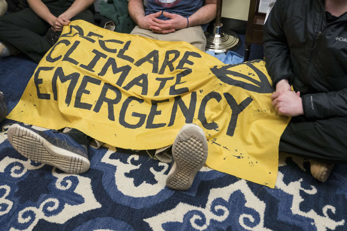 Extinction Rebellion protesters participate in a hunger strike in House Speaker Nancy Pelosi's Office in Longworth House Office Building on November 18, 2019, in Washington, D.C.