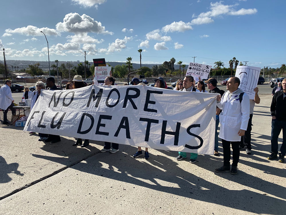 Doctors protest at the gates of the Chula Vista Border Patrol Station in San Ysidro, California, on December 9, 2019.