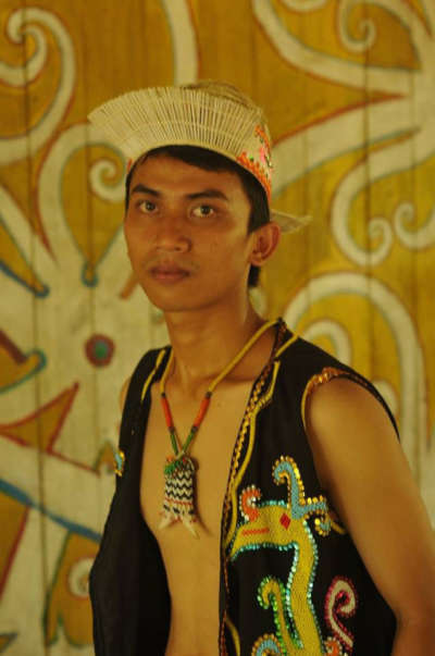 Kristianto in his traditional Dayak garb. The Dayaks of Kalimantan protest mining, logging, hydroelectric projects, and palm oil cultivation to protect their ancestral lands.