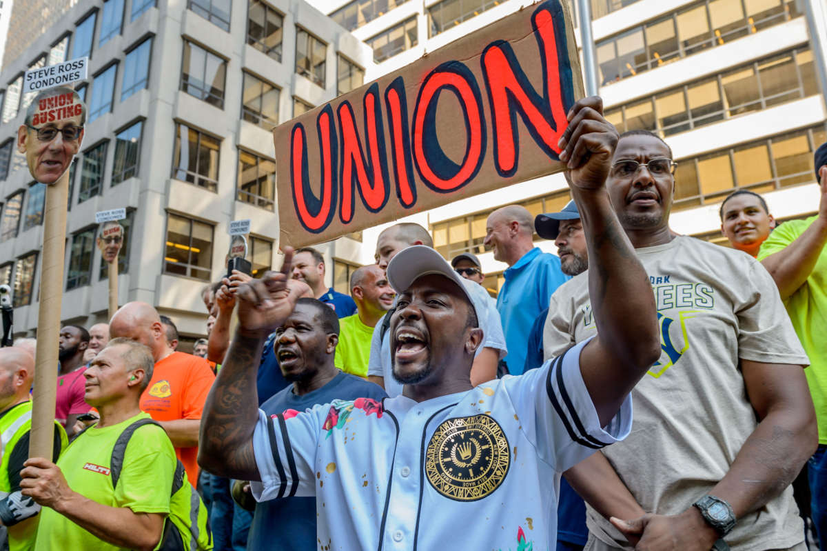 Union workers rally outside the NFL Headquarters in Manhattan, August 22, 2018.