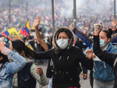 Demonstrators take part in a protest over a fuel price hike ordered by the government to secure an IMF loan, in Quito, Ecuador, on October 11, 2019.