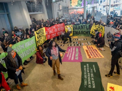 Activists took over the lobby at the Whitney Museum of American Art to protest and demand the removal of the museums board of directors Vice Chairman Warren B. Kanders.