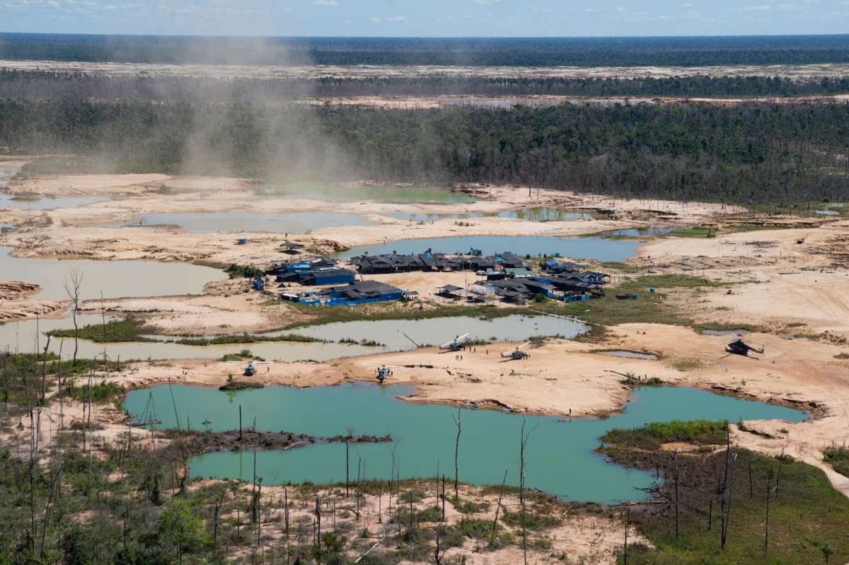 An aerial view over a chemically deforested area of the Amazon rainforest caused by illegal mining activities in the river basin of the Madre de Dios region in southeast Peru, on May 17, 2019.