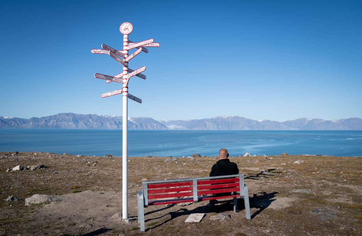 Signs show the distances to various cities in the town of Pond Inlet, in the Canadian Arctic, where a small Inuit settlement with only 1,300 inhabitants will deal with the consequences of climate change. Global warming here is two to three times stronger than in other regions of the world.