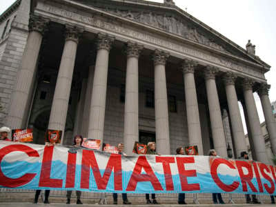 Environmental activists rally for accountability for fossil fuel companies outside of New York Supreme Court on October 22, 2019, in New York City.