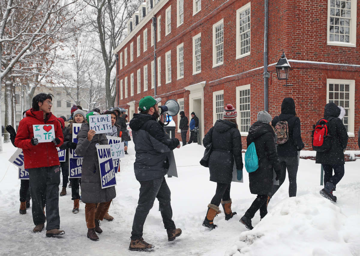 Participants in a Harvard graduate student strike march around Harvard Yard at Harvard University in Cambridge, Massachusetts, on December 3, 2019.