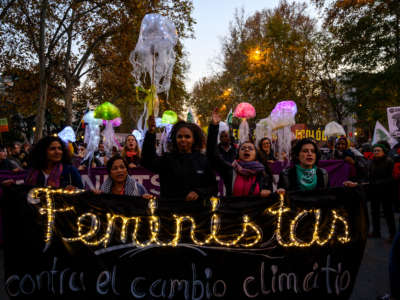 Women hold a banner that reads "Feminists against climate change" during "Fridays For Future" climate change mass protest. People are demanding urgent action on the climate crisis from world leaders attending the COP25 summit.