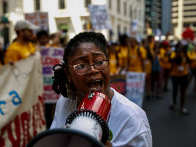 A protester fires up the crowd with chants during the Clean Energy March in Philadelphia, Pennsylvania, on July 24, 2016.