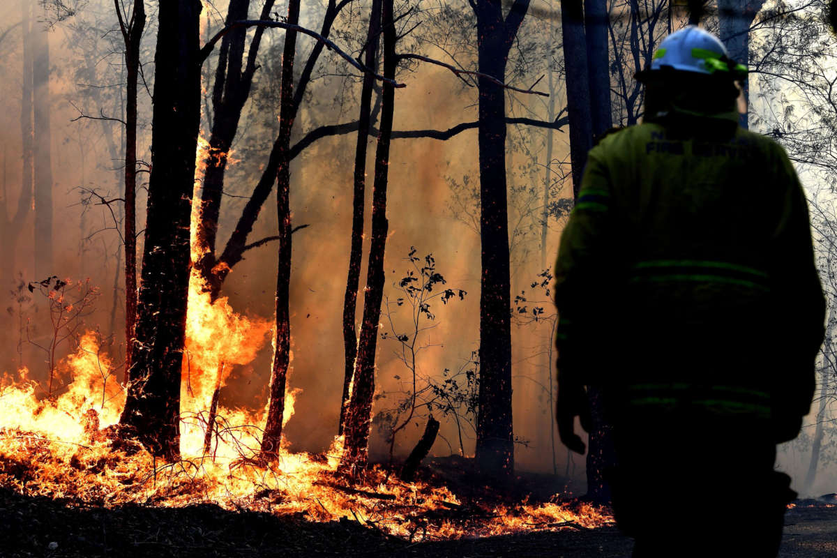 A firefighter works as a bushfire burns in Port Macquarie, New South Wales, Australia, on November 2, 2019.