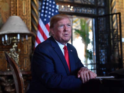 President Trump answers questions from reporters at the Mar-a-Lago estate in Palm Beach, Florida, on December 24, 2019.