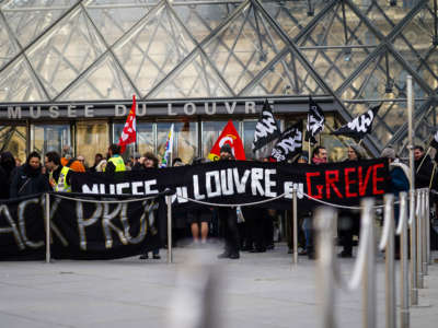 Strikers block the Louvre Museum entrance as a strike over planned pension reform continues in Paris, France, January 17, 2020.