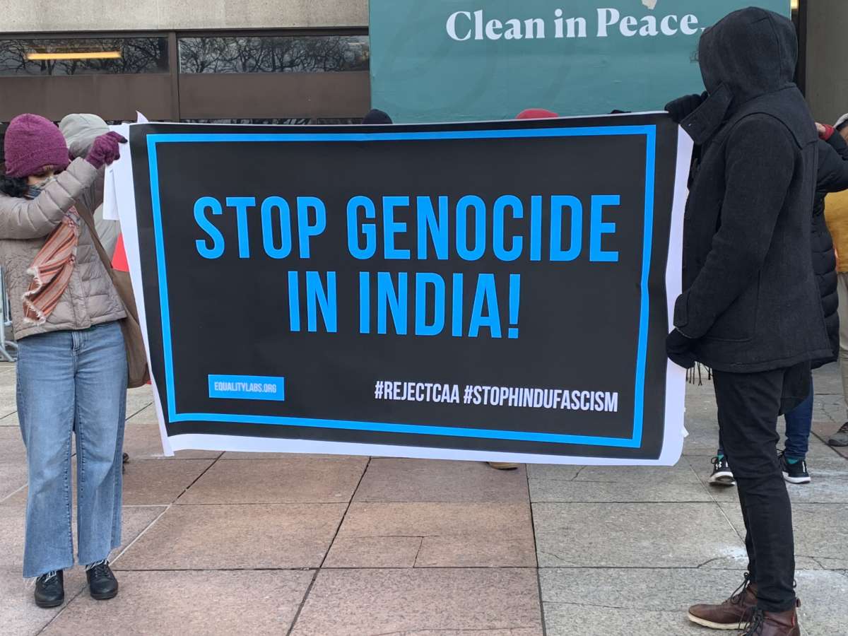 Protesters hold up banner during demonstration on January 19, 2020, in Jersey City, New Jersey, against the Citizenship Amendment Act, which grants citizenship to "prosecuted minorities" from neighboring states, with the exception of Muslims.