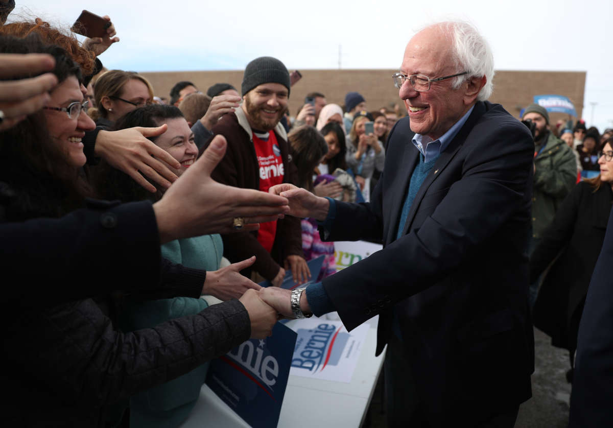 Bernie Sanders shakes hands with supporters