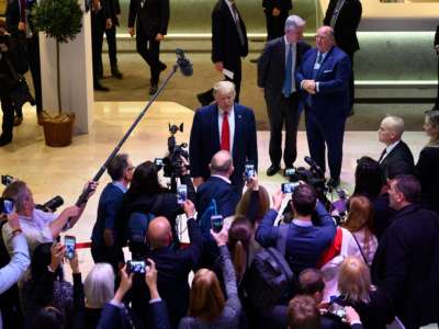 Journalists surround Donald Trump