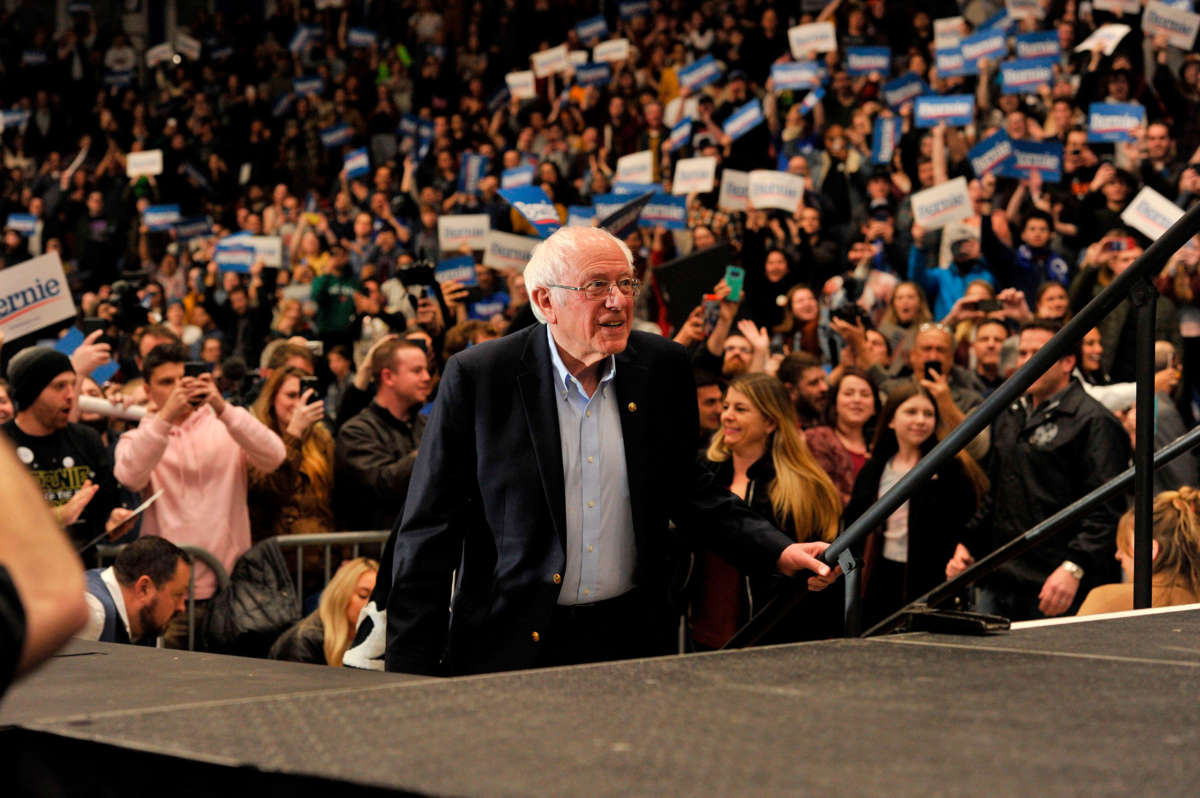 Sen. Bernie Sanders arrives on stage for a rally at the University of New Hampshire in Durham, New Hampshire on February 10, 2020.