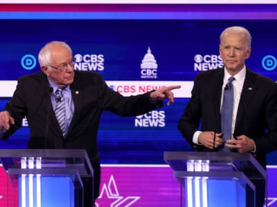 Bernie Sanders points at Joe Biden during a debate