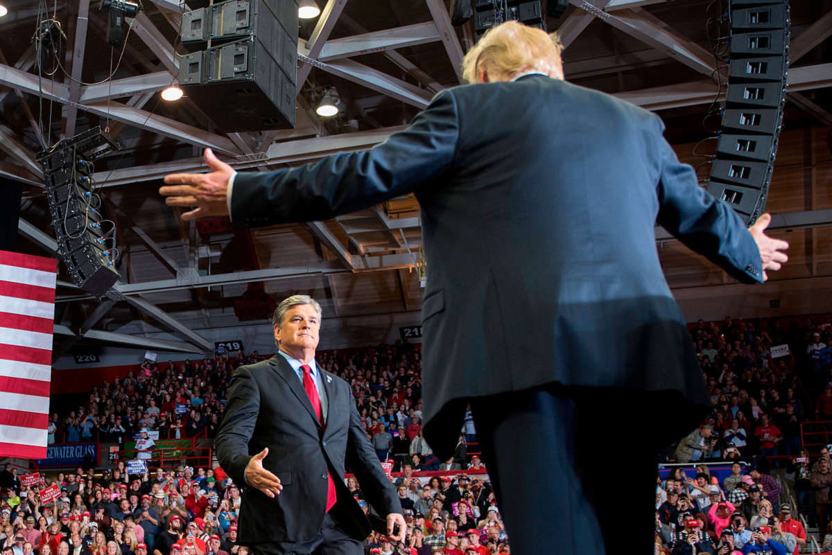 President Trump greets talk show host Sean Hannity at a Make America Great Again rally in Cape Girardeau, Missouri, on November 5, 2018.