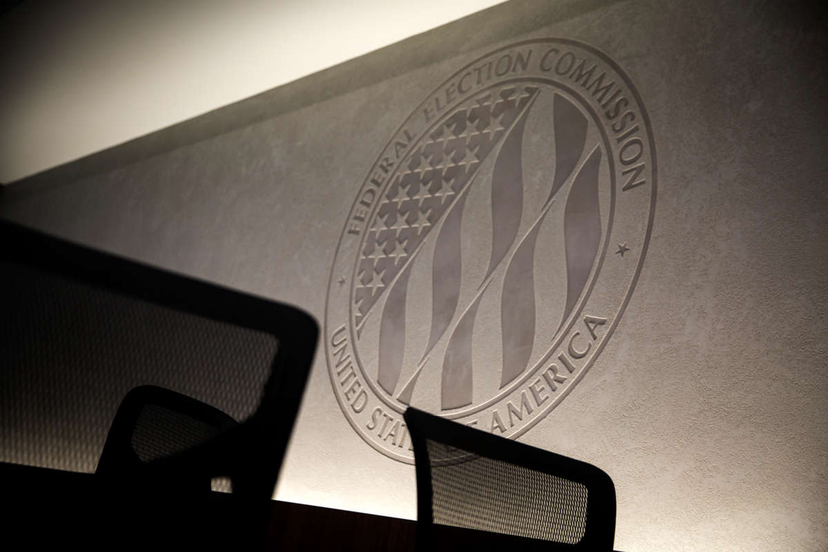 The seal of the Federal Election Commission is engraved into a stone wall inside its headquarters