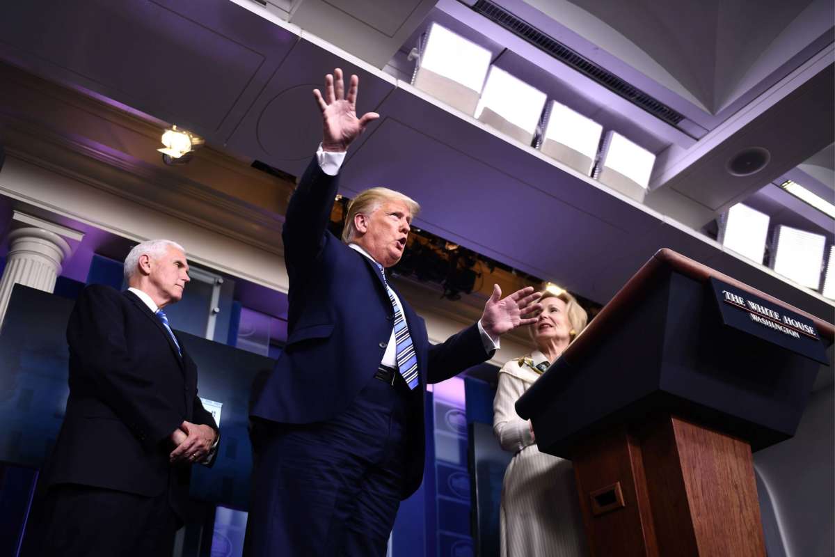President Trump gestures next to Response coordinator for White House Coronavirus Task Force Deborah Birx and Vice President Pence during the daily briefing on the novel coronavirus, COVID-19, at the White House, March 23, 2020, in Washington, D.C.