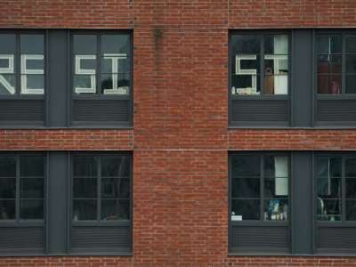 A message to "resist" is seen in the windows of an apartment building in the Williamsburg section of Brooklyn on March 25, 2020, in New York.