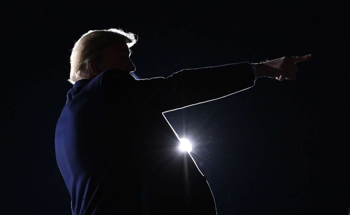 President Trump points after speaking during a rally in support of Republican incumbent senators Kelly Loeffler and David Perdue in Dalton, Georgia, on January 4, 2021.