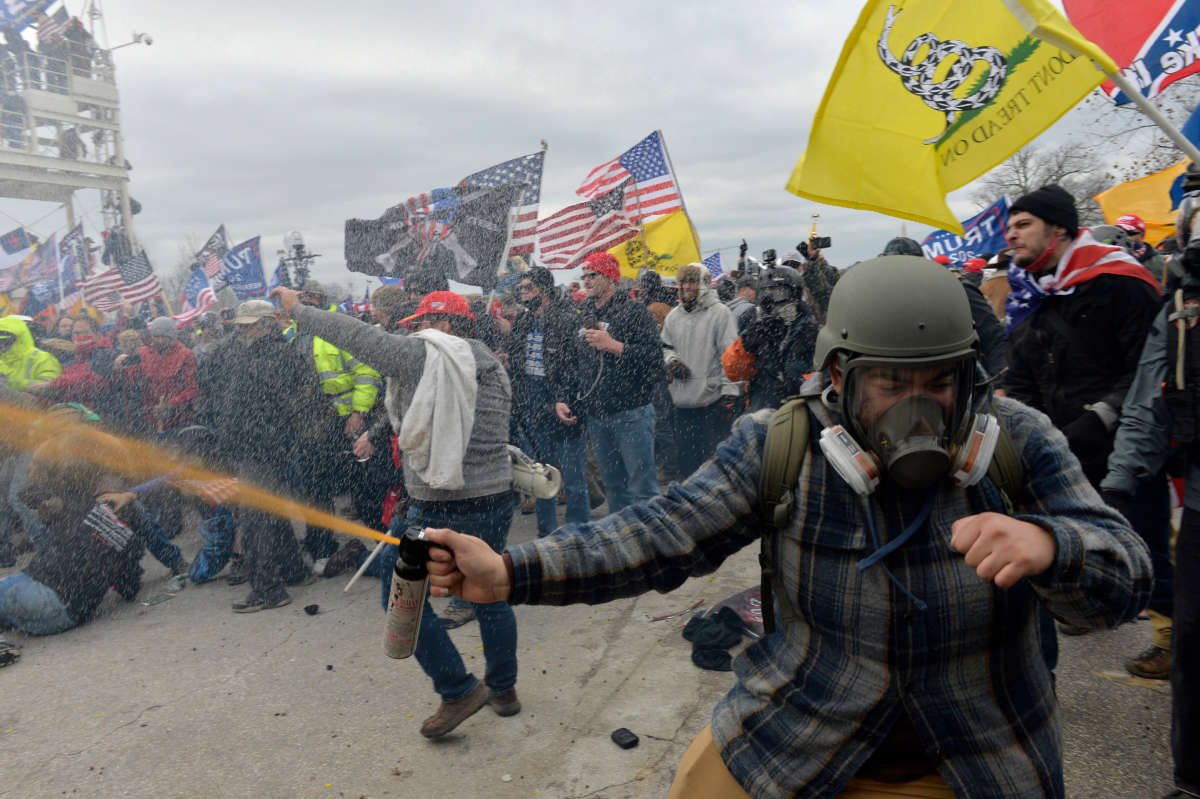 Trump loyalists clash with police and security forces as people try to storm the U.S. Capitol Building in Washington, D.C., on January 6, 2021.