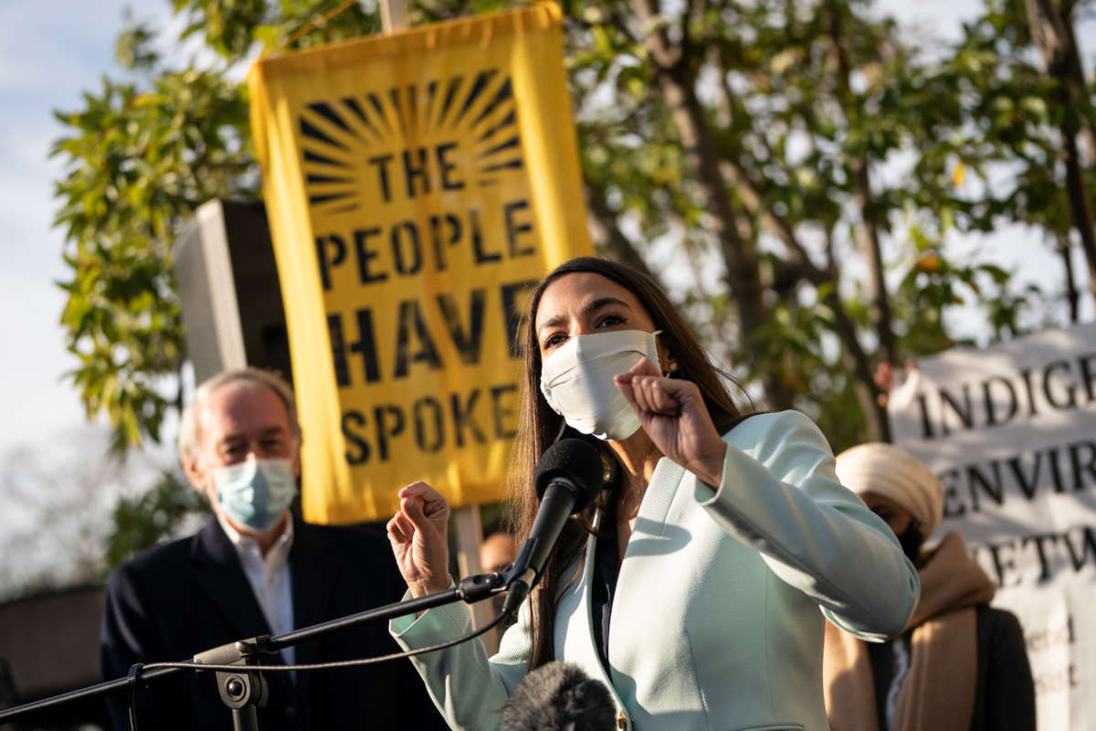 Rep. Alexandria Ocasio-Cortez speaks outside of the Democratic National Committee headquarters on November 19, 2020, in Washington, D.C.