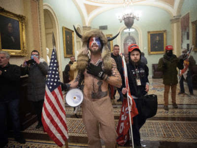 A pro-Trump mob confronts U.S. Capitol police outside the Senate chamber of the U.S. Capitol Building on January 6, 2021, in Washington, D.C.