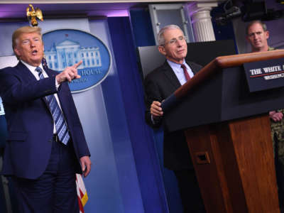 Director of the National Institute of Allergy and Infectious Diseases Anthony Fauci stands at the podium as President Trump dismisses a question during an unscheduled briefing after a Coronavirus Task Force meeting at the White House on April 5, 2020, in Washington, D.C.