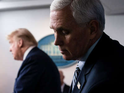 Vice President Pence listens as President Trump speaks at a press briefing with members of the White House Coronavirus Task Force on April 4, 2020, in Washington, D.C.