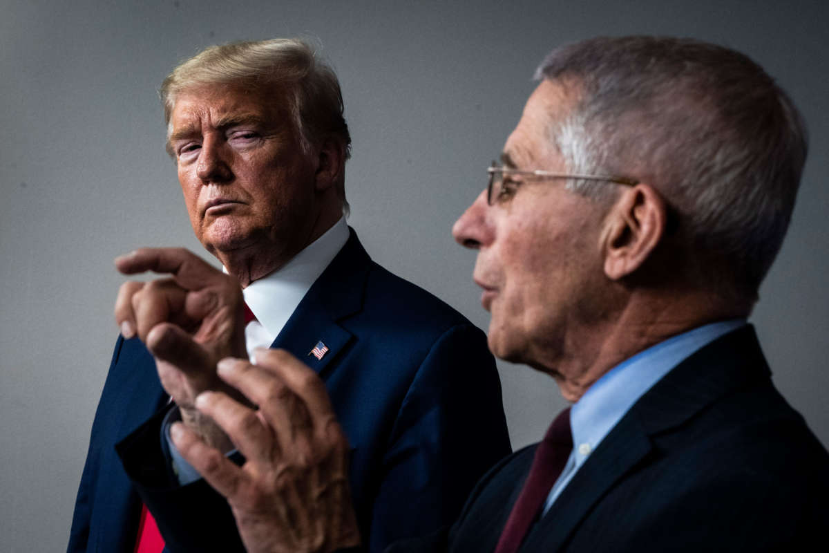 President Trump listens as National Institute for Allergy and Infectious Diseases Director Dr. Anthony Fauci speaks with members of the coronavirus task force during a briefing in response to the COVID-19 pandemic in the James S. Brady Press Briefing Room at the White House on March 31, 2020, in Washington, D.C.
