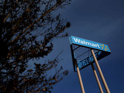 A sign is posted outside of a Wal-Mart store on February 20, 2014, in San Lorenzo, California.