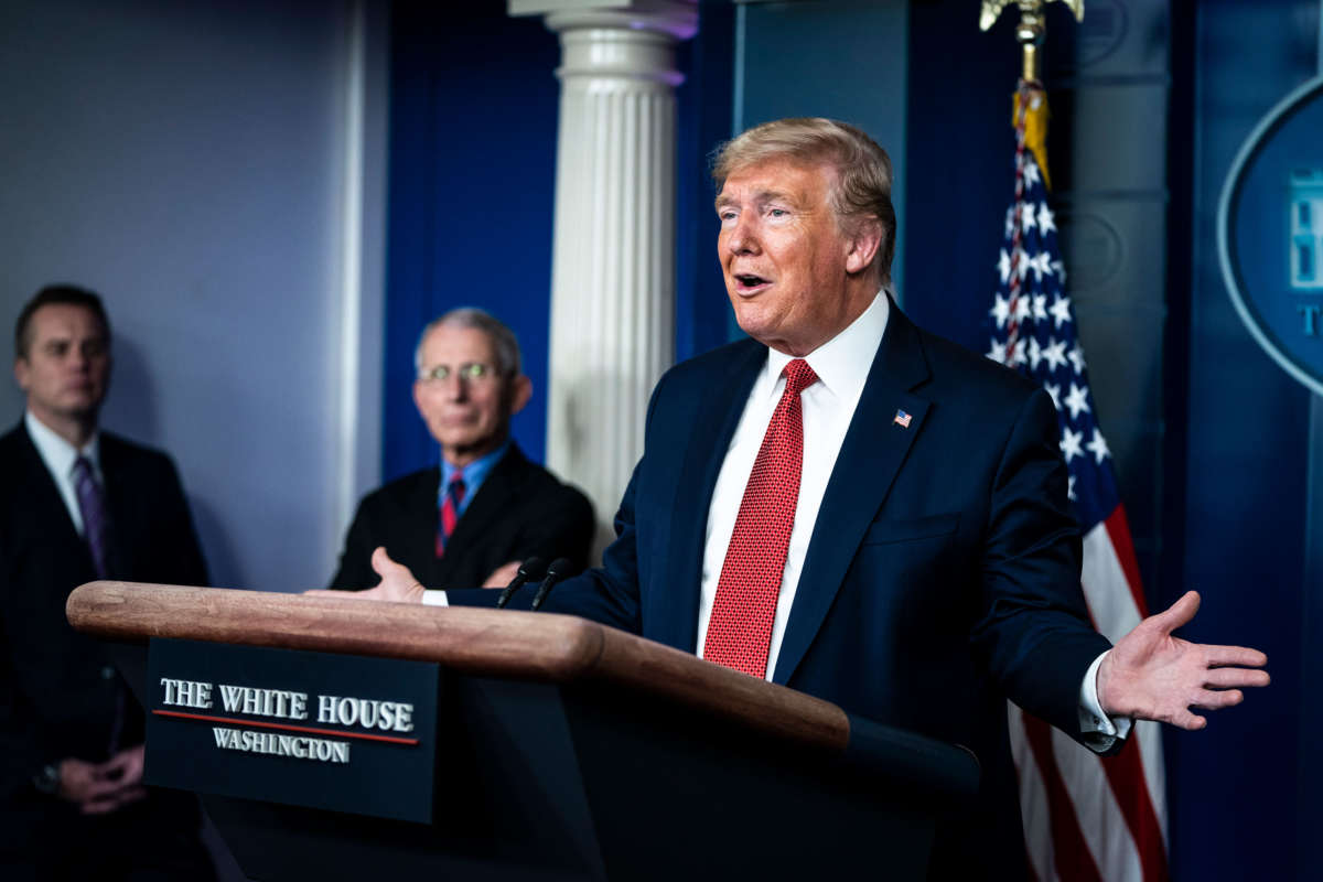President Trump speaks with members of the coronavirus task force during a briefing in the James S. Brady Press Briefing Room at the White House on March 25, 2020, in Washington, D.C.