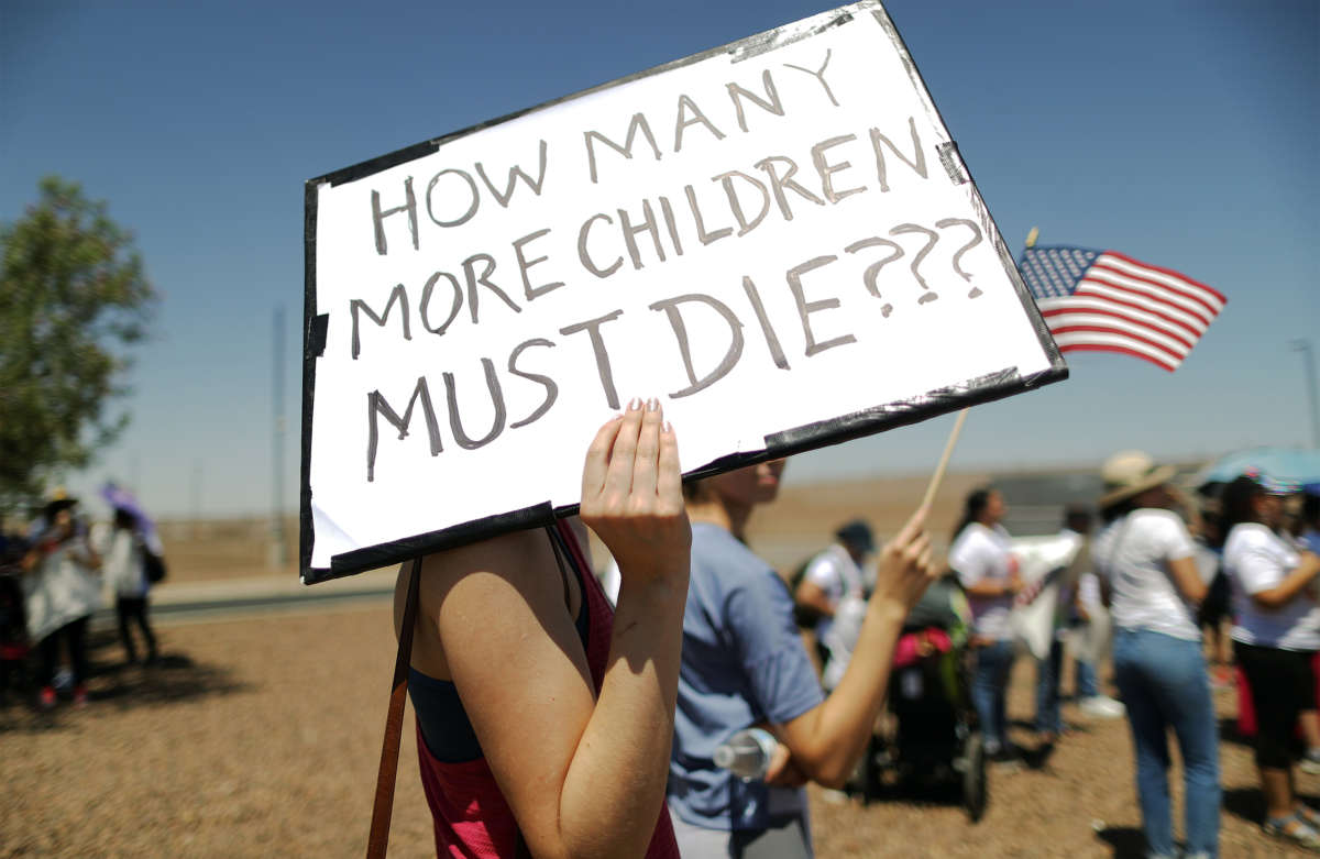 Protesters demonstrate in front of the U.S. Border Patrol facility where lawyers reported that detained migrant children were held unbathed and hungry on June 27, 2019, in Clint, Texas.