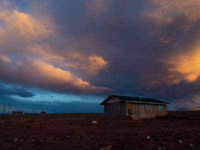 Storm clouds pass over one of many rural homes on the Navajo reservation which do not have electricity or running water during the coronavirus pandemic on March 27, 2020, in Cameron, Arizona.