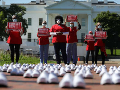 Members of the National Nurses United stand in protest among empty shoes representing nurses that they say have died from COVID-19 in Lafayette Park across from the White House, May 7, 2020, in Washington, D.C.