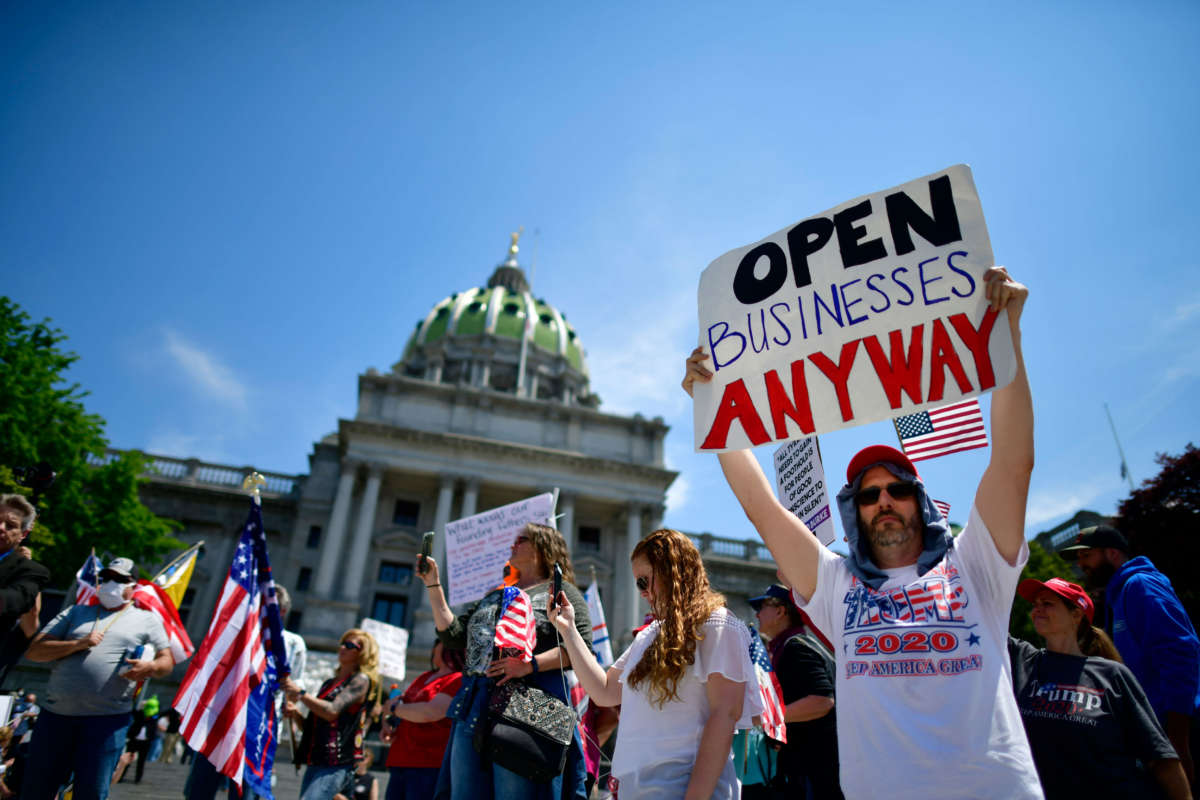 Demonstrators rally outside the Pennsylvania Capitol Building regarding the continued closure of businesses due to the coronavirus pandemic on May 15, 2020, in Harrisburg, Pennsylvania.
