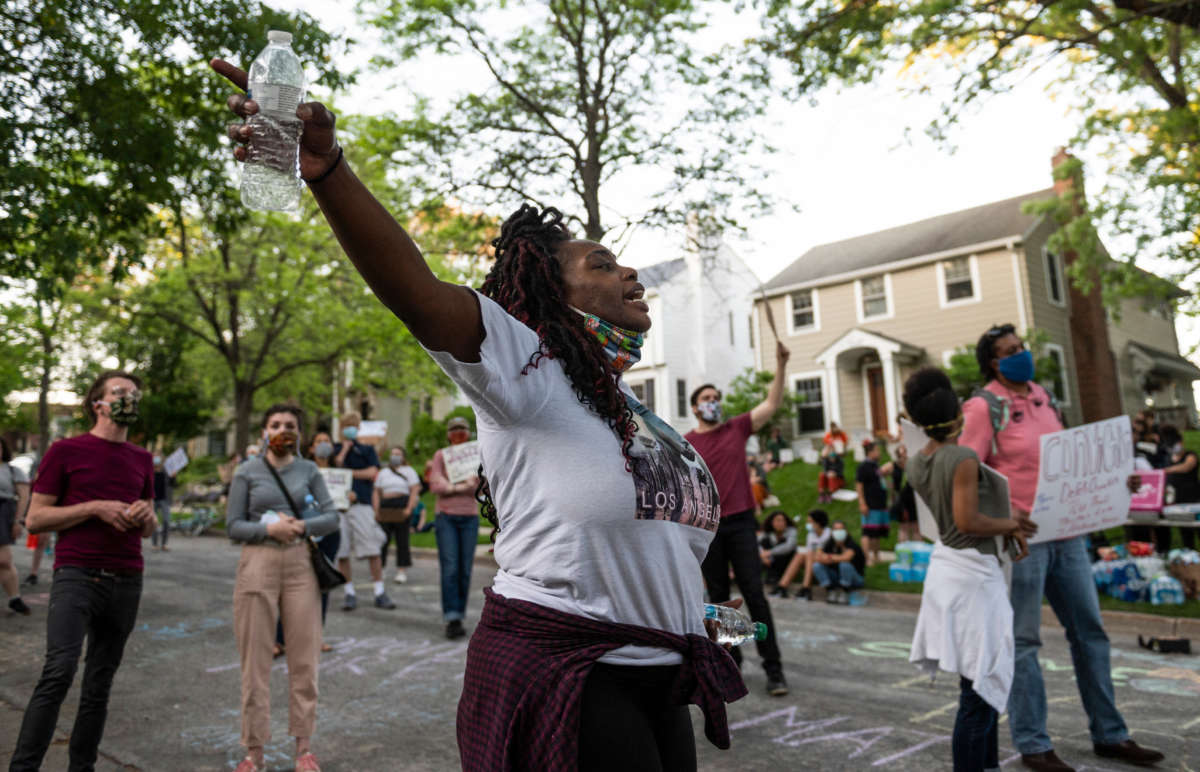 A group of protesters gather outside the home of Hennepin County Attorney Mike Freeman on May 28, 2020, in Minneapolis, Minnesota.