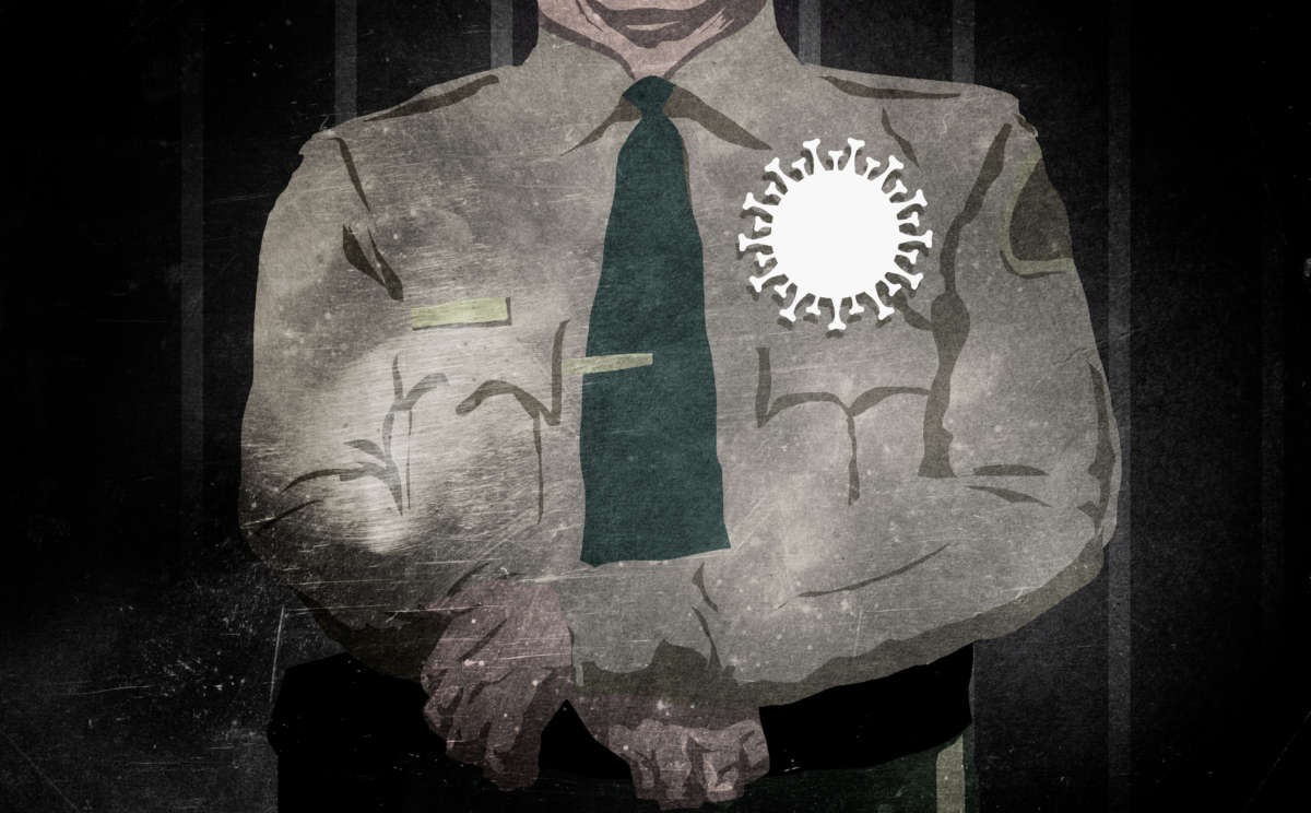 A sheriff with a COVID-19 badge stands in front of prison bars